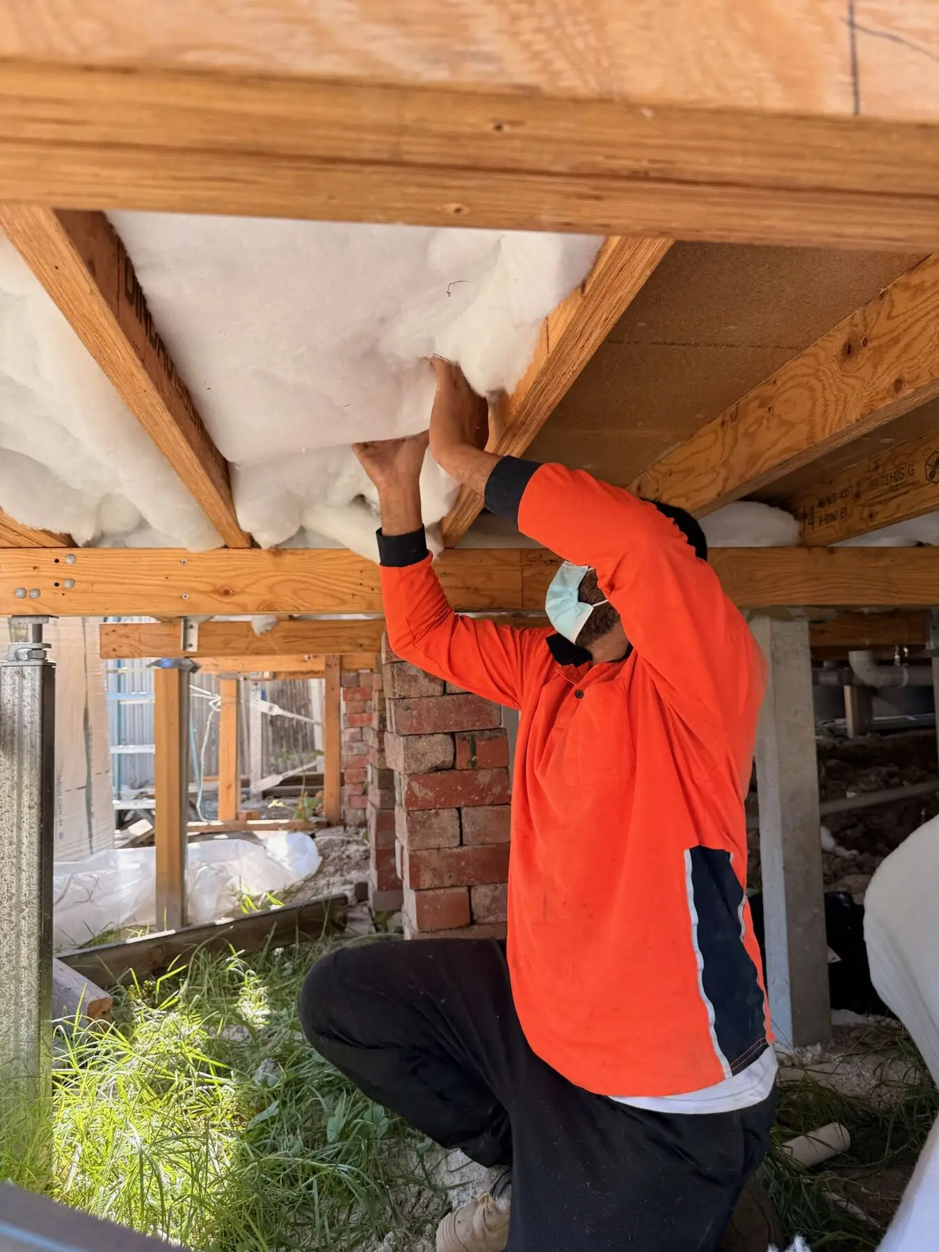 Insulation fitted under a timber floor